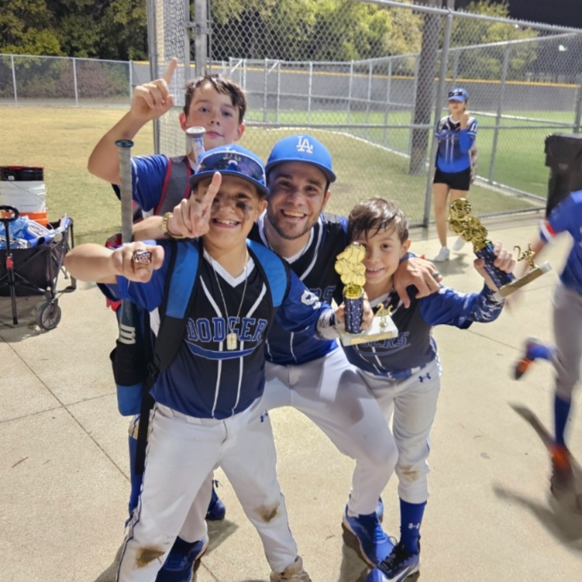 Matt Young celebrating with young Dodgers players holding their trophies